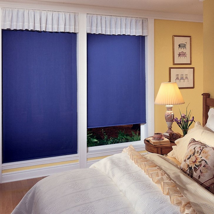 The backing on all Economy Room Darkening Roller Shades is white for a uniform look from the outside. Color: Reminiscent Navy RE1090