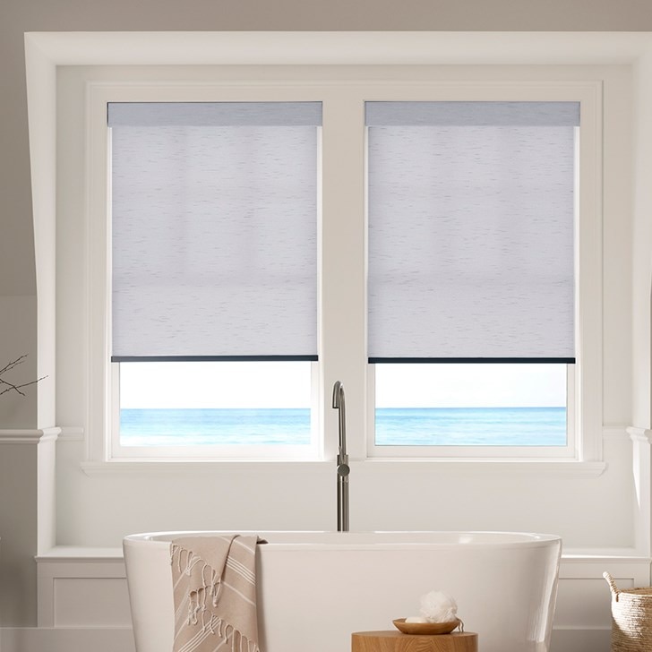 The Motorized Light Filtering Roller Shades in the Milan Indigo color with the Fabric Wrapped 4in. Cornice.