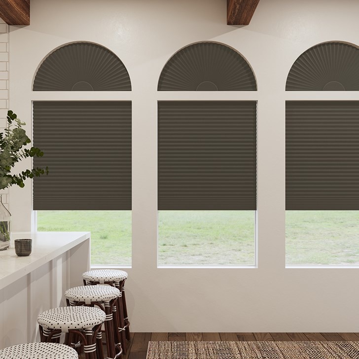 Blackout Cellular Arch and Blackout Cellular Shades in the Dark Chocolate color.