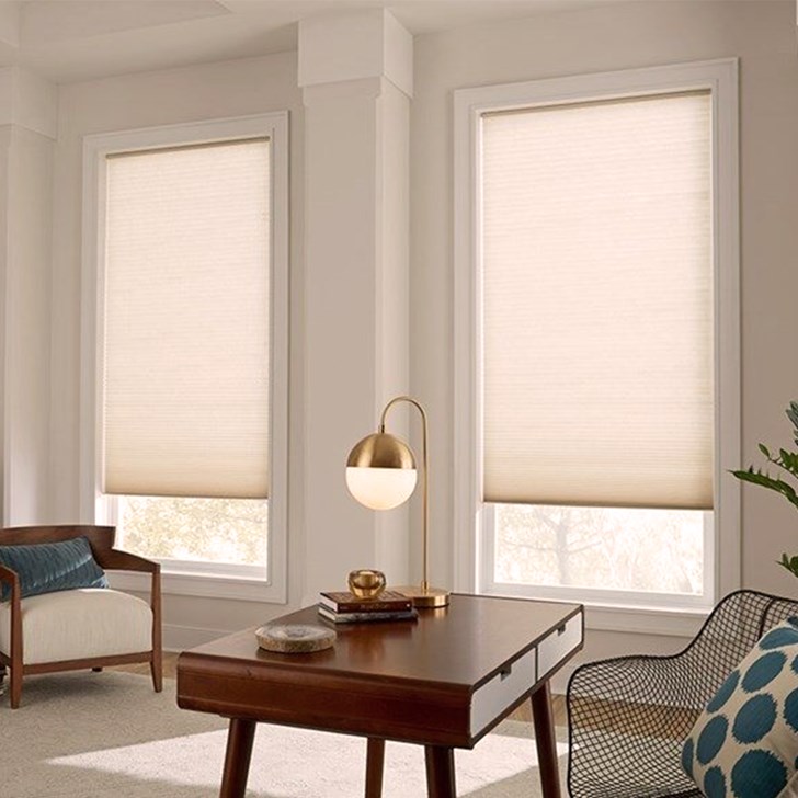 Light filtering cellular shade in soft white