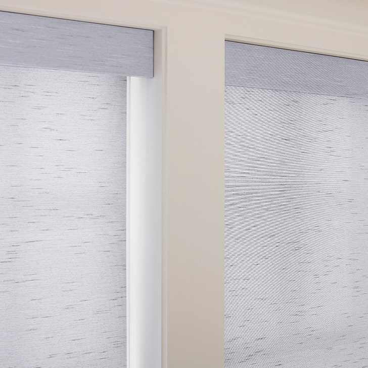 The Motorized Light Filtering Roller Shades in the Milan Indigo color with the Fabric Wrapped 4in. Cornice.